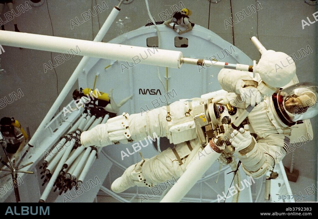 Astronauts in the neutralized gravity environment of the neutral buoyancy simulator.