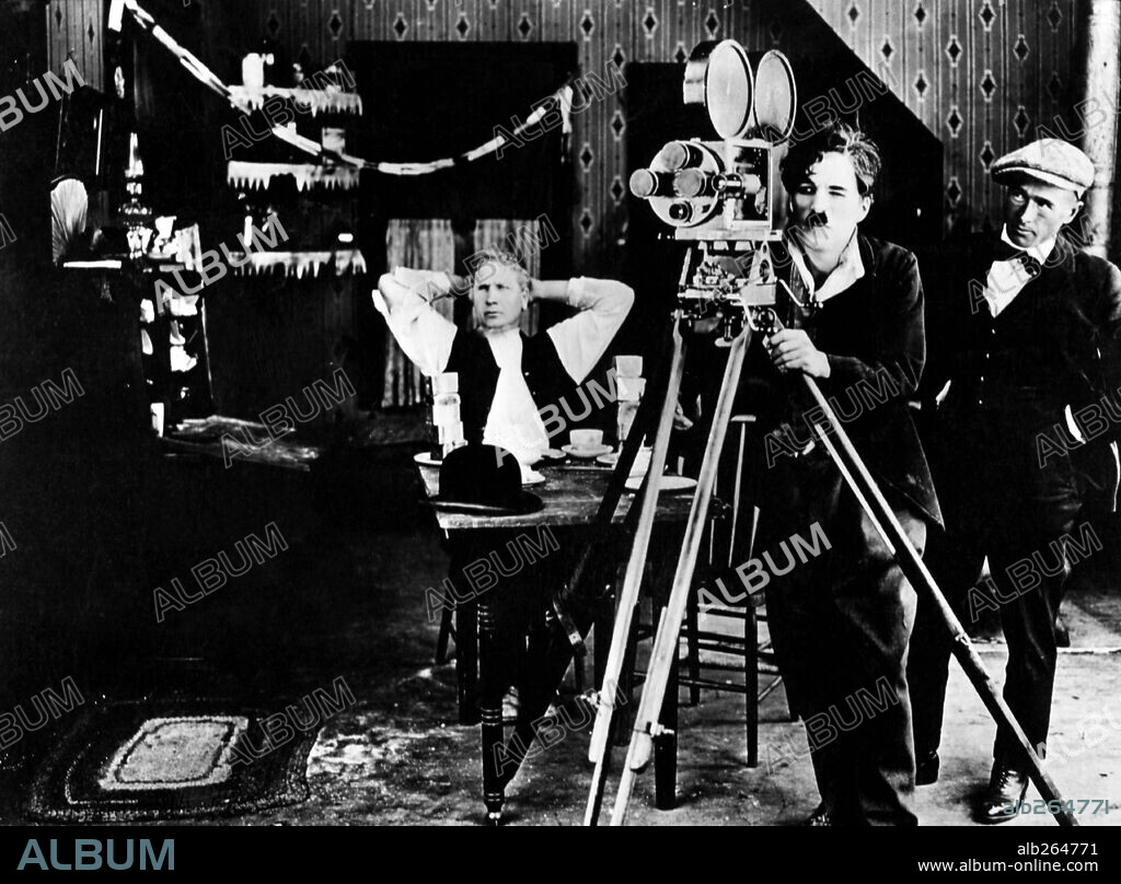 CHARLIE CHAPLIN, ROLLIE TOTHEROH and TOM WILSON in SUNNYSIDE, 1919, directed by CHARLES CHAPLIN. Copyright FIRST NATIONAL.