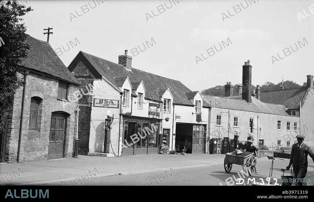Garage, South Street, Sherborne, Dorset, 1939. Sheppard's Garage apparently had both Shell and Esso petrol pumps. The garage has since been converted into houses.