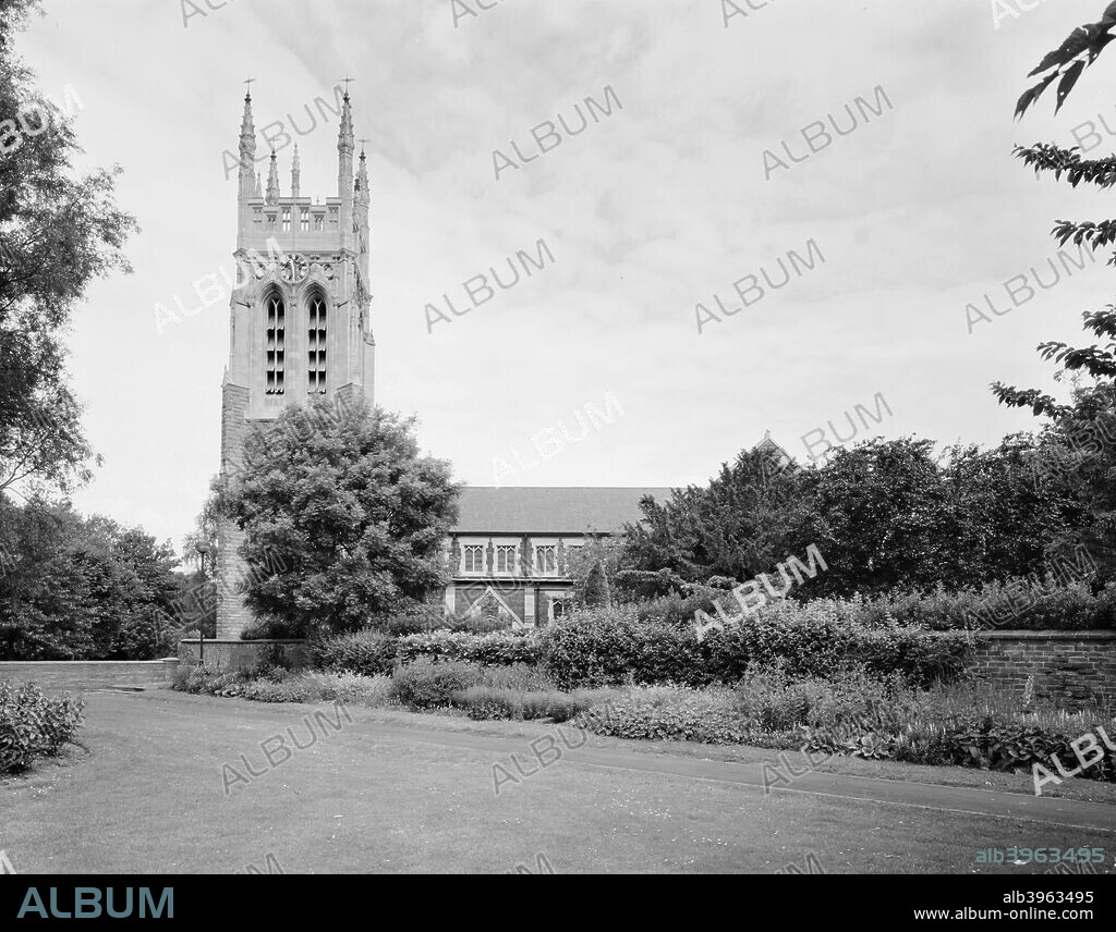 St Peter's Church, Stapenhill, Burton-upon-Trent, Staffordshire, 2000. Viewed from an adjacent garden. Two different stones were used in the construction giving the church a two toned appearance. It was constructed between 1880 and 1881 by Evans & Jolly of Nottingham.