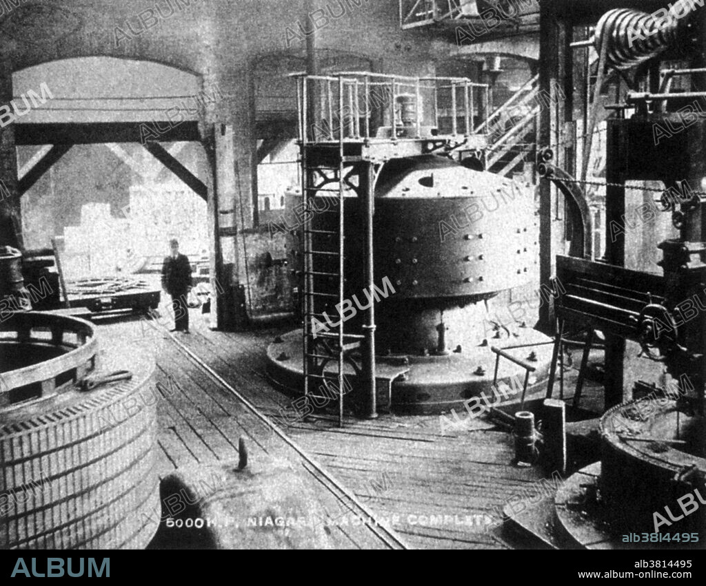 Edward Dean Adams Power Plant station at Niagara Falls during construction, 1895. In 1893, Westinghouse Electric (which had built the smaller-scale Ames Hydroelectric Generating Plant two years earlier) was hired to design a system to generate alternating current on Niagara Falls, and three years after that this large-scale AC power system was created (activated on August 26, 1895). The Adams Power Plant Transformer House remains as a landmark of the original system. By 1896, financing from moguls including J.P. Morgan, John Jacob Astor IV, and the Vanderbilts had fueled the construction of giant underground conduits leading to turbines generating upwards of 100,000 horsepower (75 MW), sent as far as Buffalo, 20 miles away.
