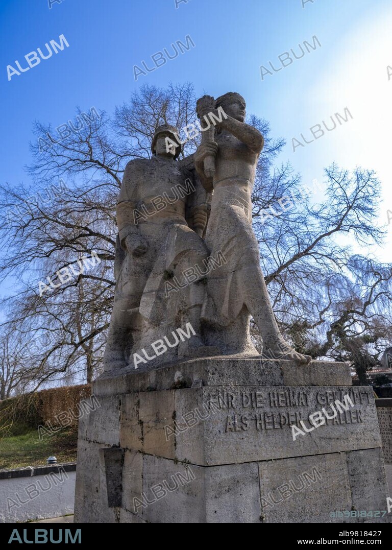 Memorial for those killed in World War I by Emil Sutor (1888) (1974); erected in April 1939; next to the Minster of St. Mary and St. Mark; a Romanesque former Benedictine monastery church in the district of Mittelzell on the island of Reichenau in Lake Constance; district of Constance. The monastery island of Reichenau; together with the church; has been a UNESCO World Heritage Site since 2000. Reichenau; Baden-Württemberg; Germany; Europe.