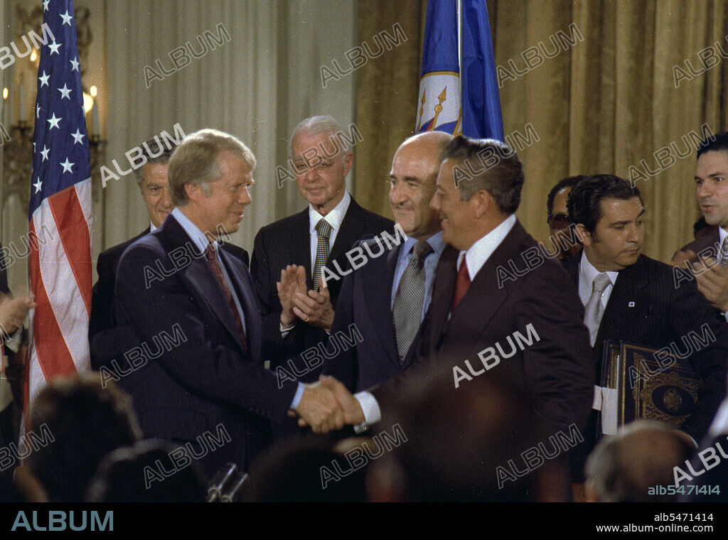 Jimmy Carter and General Omar Torrijos shake hands after signing the Panama Canal Treaty. circa  09/07/1977.