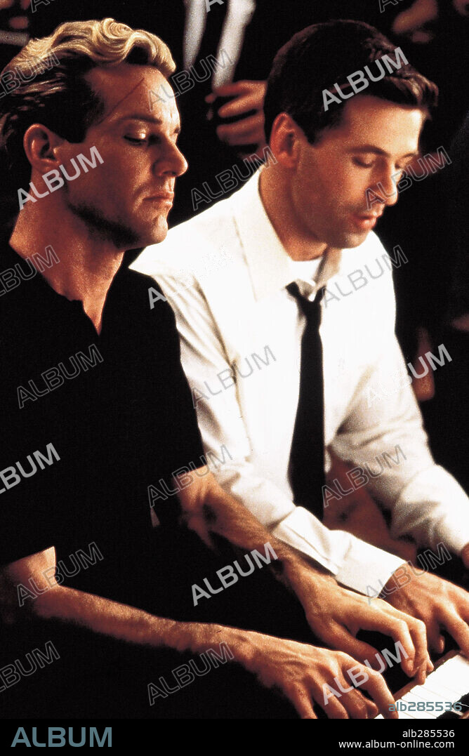 ALEC BALDWIN and DENNIS QUAID in GREAT BALLS OF FIRE!, 1989, directed by JIM MCBRIDE. Copyright ORION PICTURES.