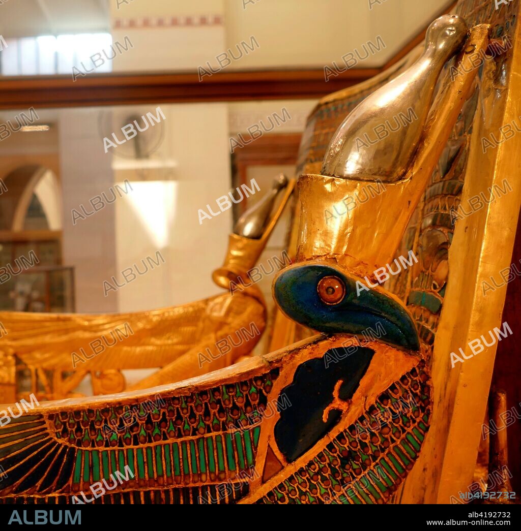 The golden throne of King Tutankhamen was discovered by Howard Carter in the tomb of the King. The style was common for royal chairs of the Eighteenth Dynasty. Carved in wood. the armchair is extended in gold and silver overlay. Calcite. Colored glass. faience and semi-precious stones are used for the inlays.