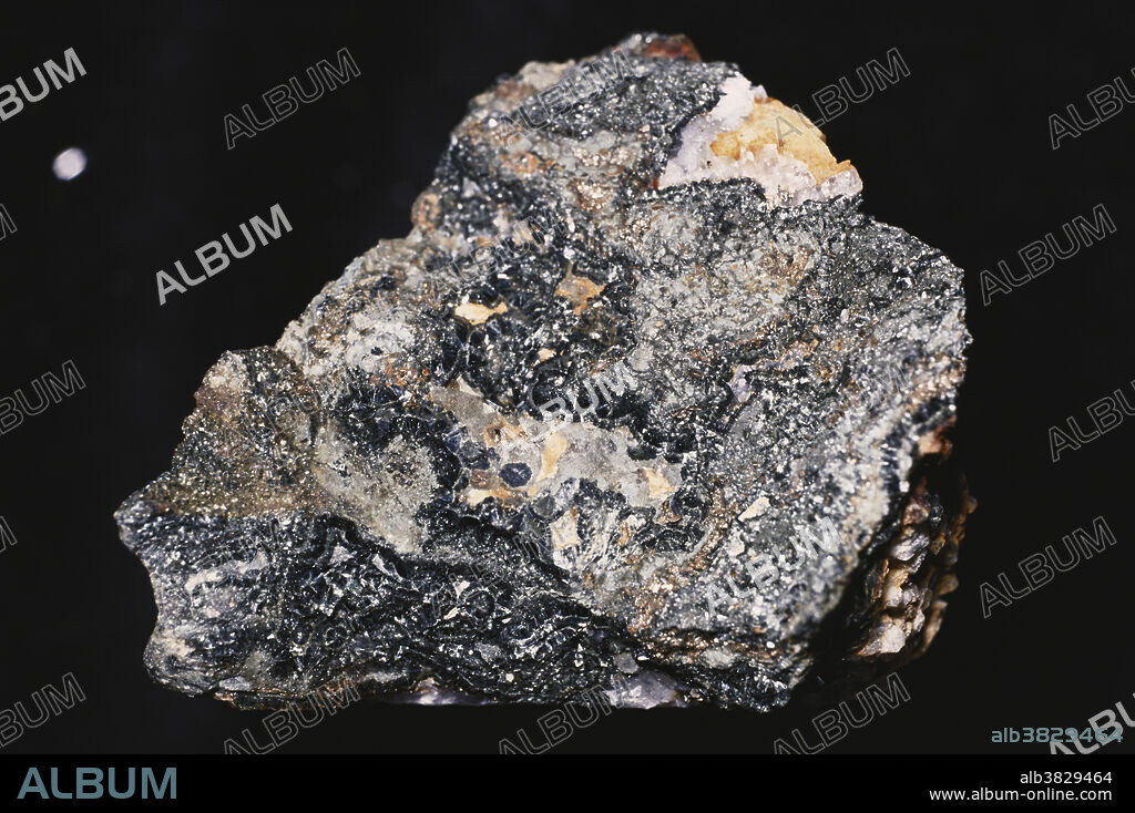 Chamosite (black crystals), a hydrous aluminium silicate of iron formed from metamorphosed iron deposits.