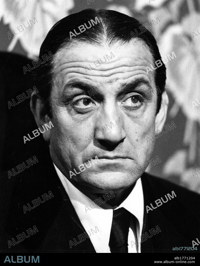 Lino Ventura playing Vito Genovese. The Italian actor Lino Ventura playing the mobster Vito Genovese on the film set. Rome, 1970s.
