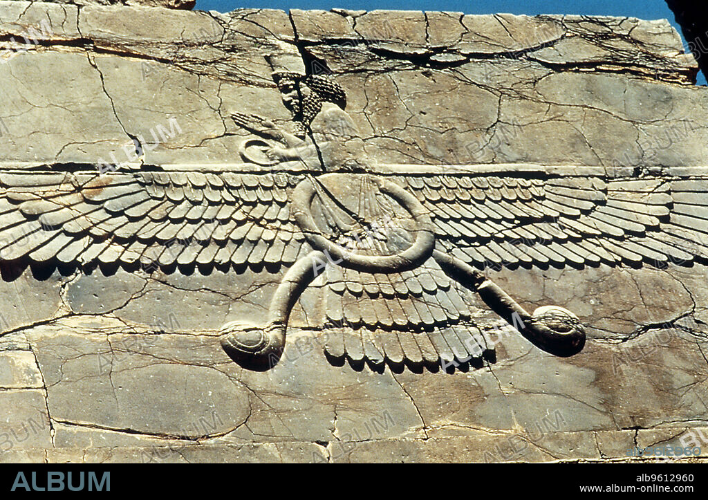 ANON. Ahura Mazda (c-500). Winged symbol of Ahura Mazda (Ormazd, Ormuzd, Ohrmazd), Lord of Wisdom, supreme god of the Zorastrian (Zarathustrian) religion of Persia. This relief is from the Royal Audience Hall of Darius I (548 BC-486 BC), King of Persia, at Persepolis, (in modern Iran), built c500 BC.