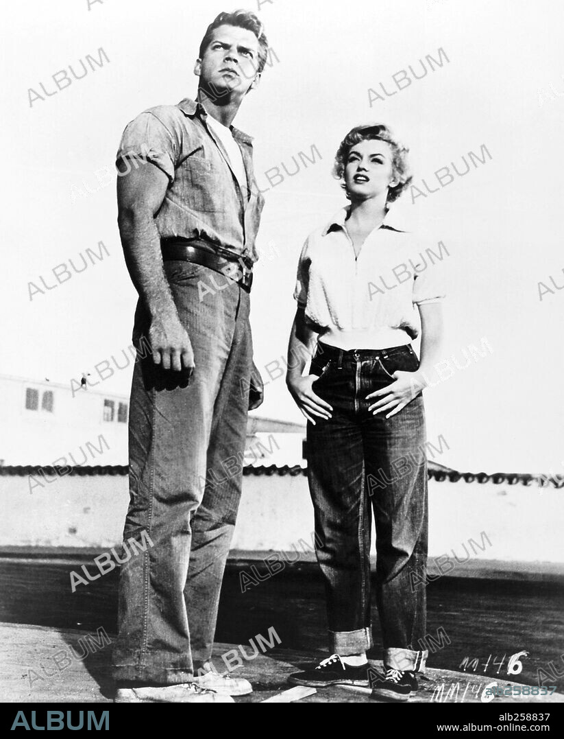 KEITH ANDES and NORMA JEAN BAKER. KEITH ANDES and MARILYN MONROE in CLASH BY NIGHT, 1952, directed by FRITZ LANG. Copyright RKO.