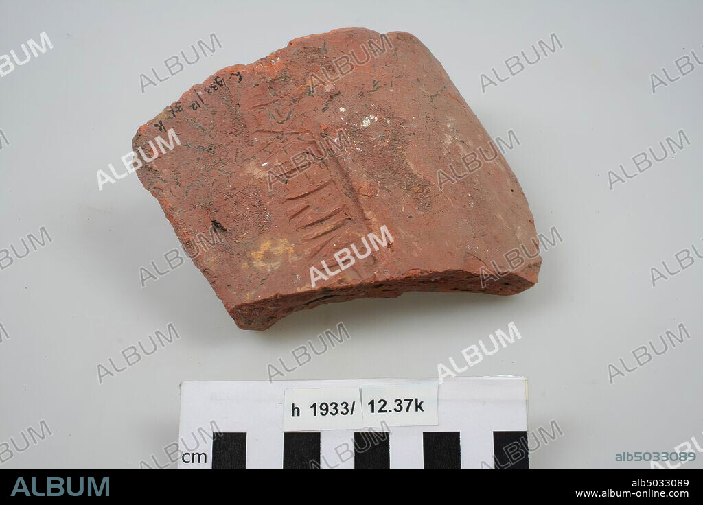 Fragment of an imbrex of brick with stamp EXGERINF., roof tile (imbrex), fragment, earthenware, brick, 14.5 x 11.9 x 7 cm, roman, Netherlands, South Holland, Katwijk, Valkenburg.
