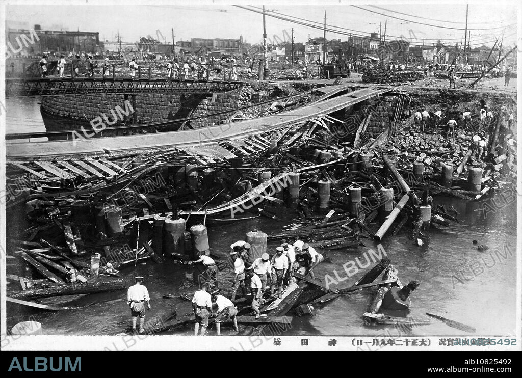 [ 1920s Japan - Great Kanto Earthquake ] Japanese soldiers at work at the ruins of Tokyos Kandabashi Bridge destroyed by the Great Kanto Earthquake (Kanto Daishinsai) of September 1, 1923 (Taisho 12). The quake, with an estimated magnitude between 7.9 and 8.4 on the Richter scale, devastated Tokyo, the port city of Yokohama, surrounding prefectures of Chiba, Kanagawa, and Shizuoka, and claimed over 140,000 victims. 20th century vintage gelatin silver print.