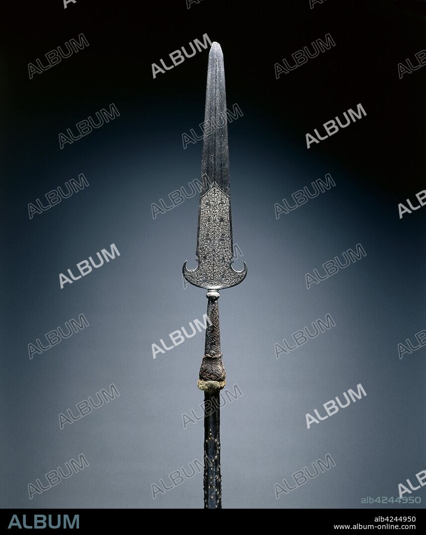 Partisan, c. 1600-1650. France, 17th century. Steel, etched; octagonal wood haft with studs and leather; remnants of velvet tassel; overall: 217.2 cm (85 1/2 in.); blade: 57.2 cm (22 1/2 in.).