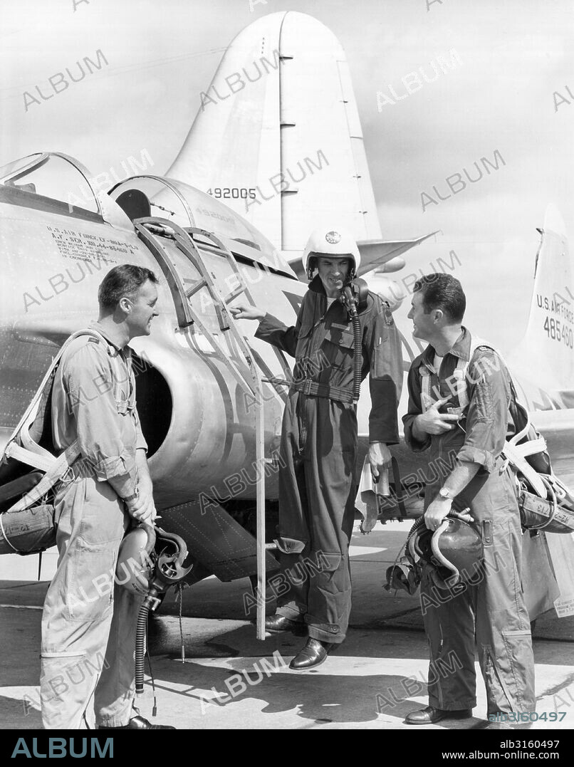 Dayton, Ohio: March 24, 1950 Student test pilot Lt. Richard Dennen gets a send off in an F-80 Shooting Star at Wright-Patterson Air Force Base from two of the Flight Test Division's top pilots. At left is Major Leonard Wiehrdt, former test school chief, and at the right is Capt. Charles E. Yeager, the first man to fly faster than the speed of sound.
