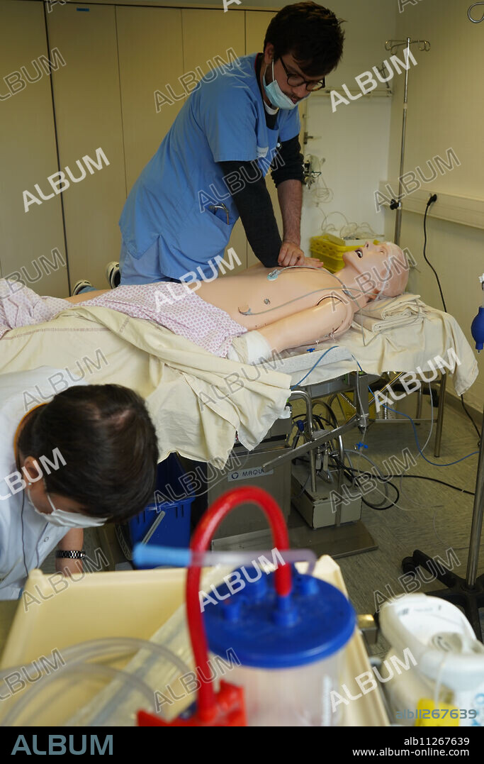 Anesthesiologist students during a critical situation resuscitation exercise at the Nimes Faculty of Medicine. Students train on a Sim Man 3 G robotic dummy.