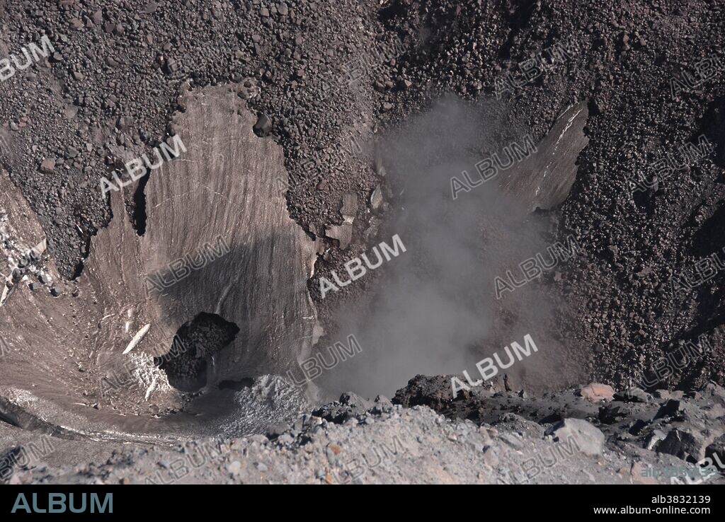 Large fumarole venting clouds of steam at the base of the lava dome in the crater of Mount St. Helens.