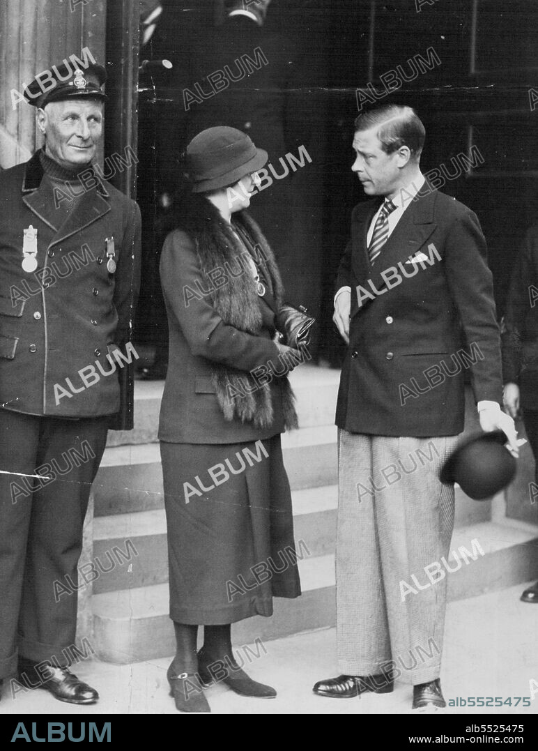 The Prince of Wales chatting to Mrs. Robert Patton, after he had presented her with her husband's V.C. on left is Coxswain Henry Blogg, of Cromer, who received a bar to his silver medal.H.R.H. the Prince of Wales presented the awards at the Annual Meeting of the Royal National Lifeboat Institution, held at the Caxton Hall, Victoria-street, this afternoon. April 20, 1934.