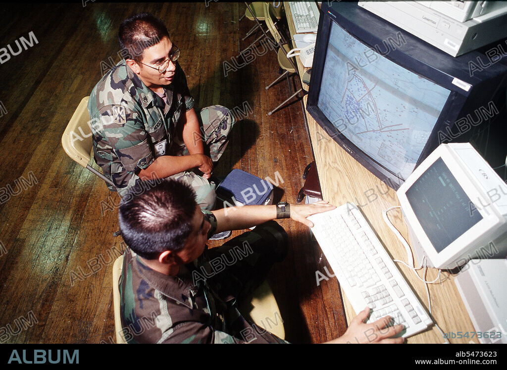 ROVING SANDS 1996 - Soldiers at Fort Bliss use one of the many computer systems used in operation of the early warning system at Joint Project Optic Cobra during exercise Roving Sands '96.