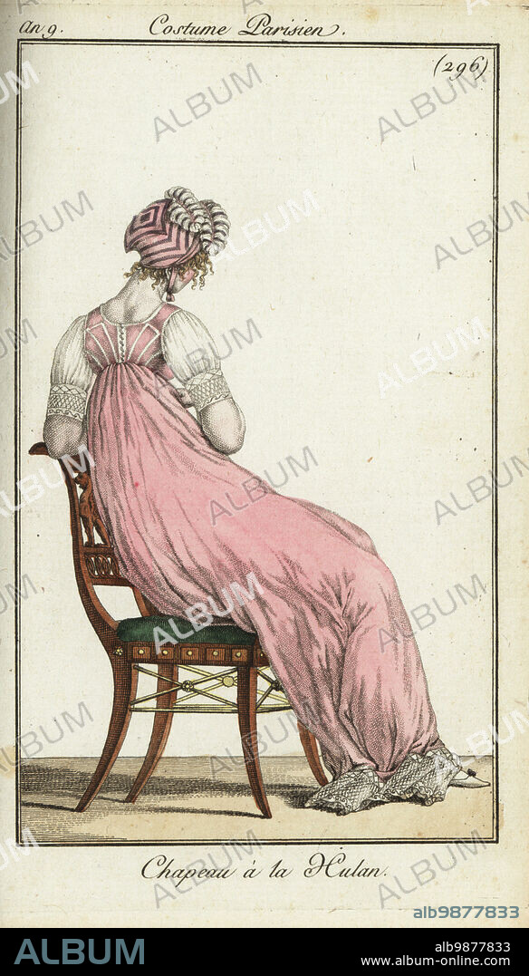 Rear view of fashionable woman in an Uhlan cap, 1801. The hat had a lozenge-shaped crown and turned up at the front like a Uhlan lancers helmet and was worn by the elegantes of Longchamps. She wears a short-sleeved dress with high waist. Chapeau a la Hulan. Handcoloured copperplate engraving from Pierre de la Mesangeres Journal des Modes et Dames, Paris, 1801. The illustrations in volume 4 were by Carle Vernet, Bosio, Dutailly and Philibert Louis Debucourt.