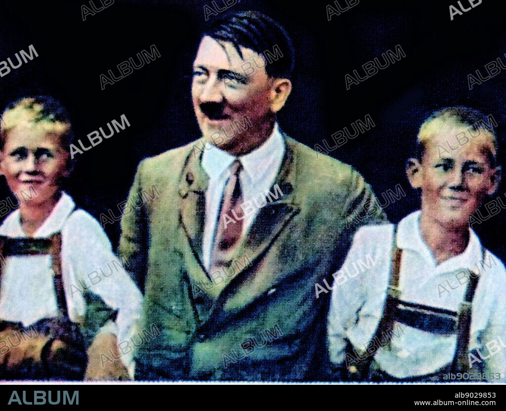 Adolf Hitler with two young aryan type boys 1934.