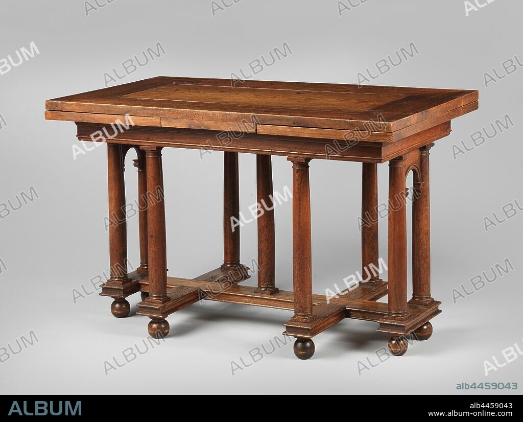 Table of walnut with nine column legs in the shape of Tuscan columns, resting on a double-cross-shaped profiled base on turned balls. The table rule is treated as a simple profiled architrave. The columns on the short sides are connected by arches on consoles. The table has two drawers. The midfield of the top is made of elm wood., anonymous, France, c. 1550 - c. 1600, wood (plant material), walnut (hardwood), beech (wood), elm (wood), h 83 cm × l 130 cm × w 73.5 cm × w 47.5 kg.
