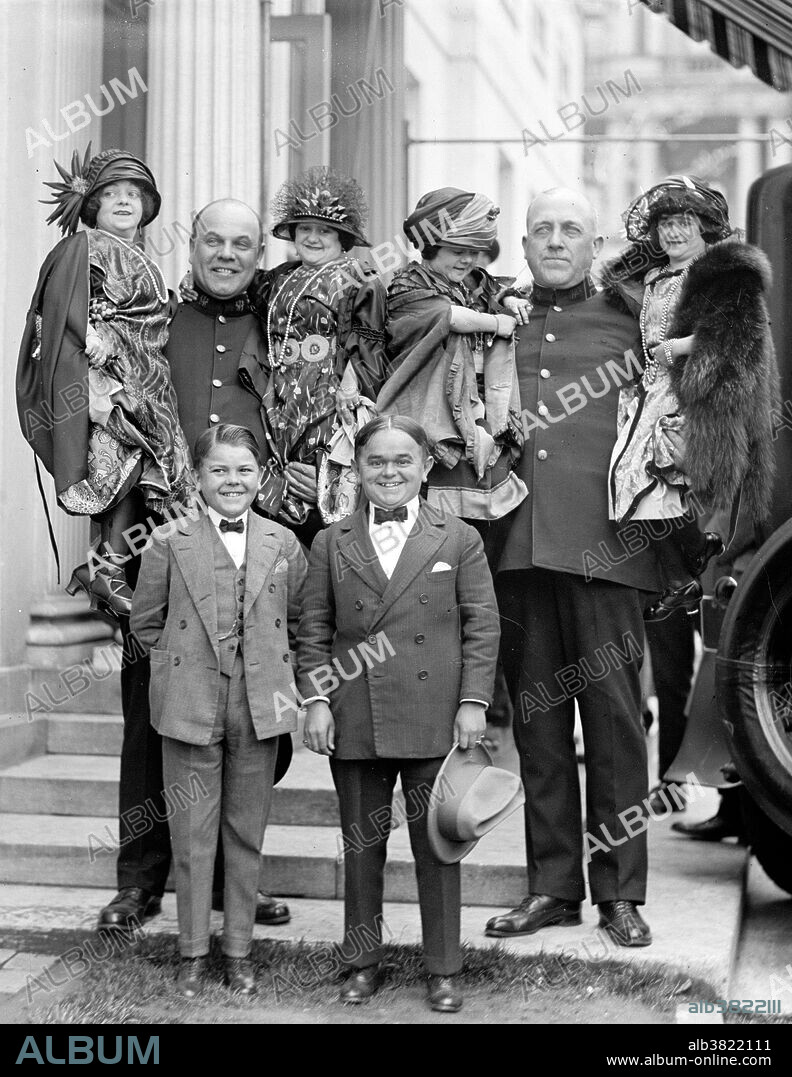 Midget is a term for a person of unusually short stature that is considered by some to be pejorative. While not a medical term, it has been applied to persons of unusually short stature, often with the medical condition dwarfism, particularly proportionate dwarfism. Midgets have always been popular entertainers. P. T. Barnum indirectly helped popularize the term "midget" when he began featuring General Tom Thumb, Lavinia Warren and Commodore Nutt in his circus. "Midget" became linked to referencing short people put on public display for curiosity and sport. Barnum's midgets, however, were elevated to a position of high society, given fantasy military titles, introduced to dignitaries and royalty, and showered with gifts. Photographed by National Photo Company, April 25, 1924.