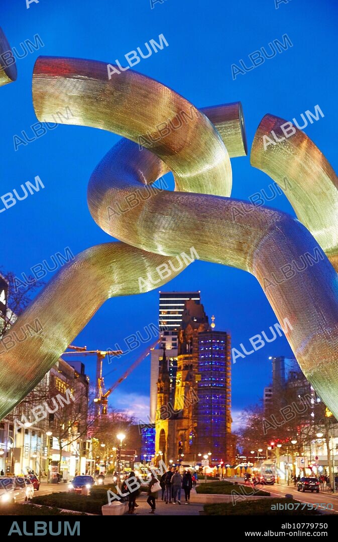 The Kaiser Wilhelm Gedächtniskirche, Emperor Wilhelm Memorial church, in front sculpture called Berlin by Brigitte Matschinsky-Denninghoff and Martin Denninghoff, Tauentzienstraße, Kurfürstendamm, Berlin, Germany.