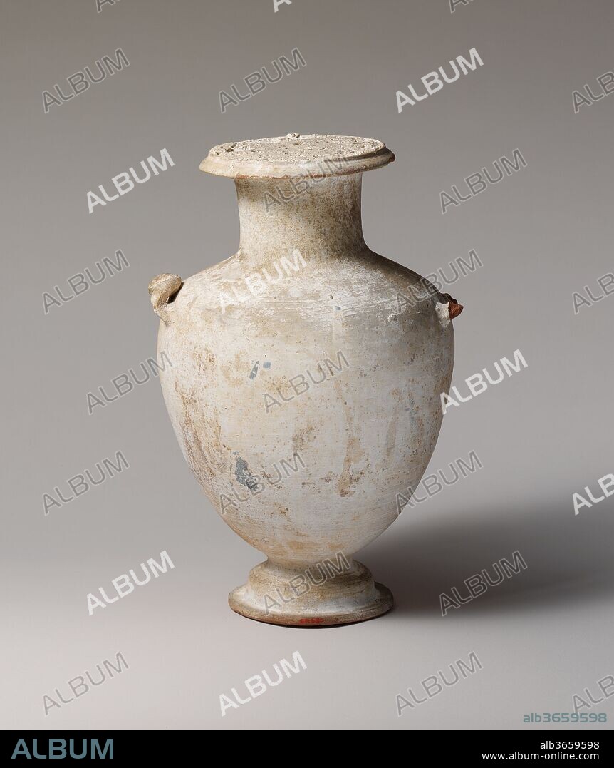 Terracotta Hadra hydria (water jar). Culture: Greek, Ptolemaic, Alexandrian. Dimensions: h. 14 7/8 in. (37.8 cm); d. 10 in. (25 cm). Date: late 3rd century B.C..
Faint traces of an elaborate helmet with a griffin crest, a shield bearing the snakey head of Medusa, and a cuirass, are evident on this white-ground hydria. A warrior's armor was a common subject for vases destined for burial, since it alluded to the both the heroic character of the deceased, as well as the manner of death. Sites in Alexandria have yielded hydriai with similar motifs in much better states of preservation, thus providing an idea of the original appearence of this vase.