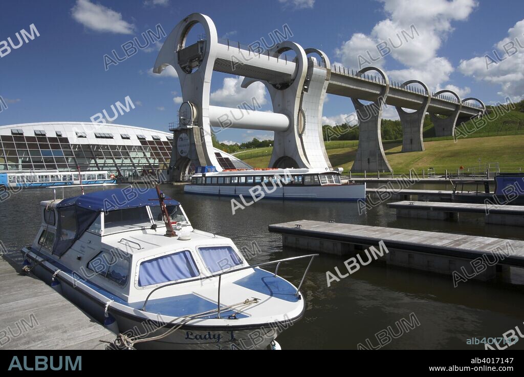 Falkirk Wheel, Stirlingshire, Scotland, 2009. The Falkirk Wheel is a rotating boat lift that connects the Forth and Clyde Canal and the Union Canal. A project funded by the Millennium Commission, it was part of a scheme to regenerate the canal system of central Scotland and was opened in 2002 as part of Queen Elizabeth II's Golden Jubilee celebrations.