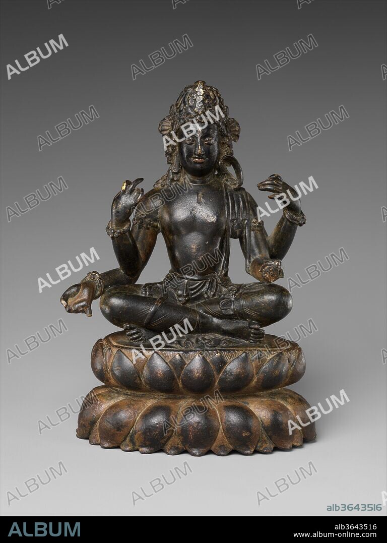 Bodhisattva Avalokiteshvara. Culture: Pakistan (Swat Valley). Dimensions: H. 6 3/4 in. (17.1 cm); W. 4 3/4 in. (12.1 cm); D. 3 1/2 in. (8.9 cm). Date: 7th century.
This is one of the greatest early medieval metal icons associated with Buddhist art of the Swat Valley. The work is closely connected to related major schools of religious image making in Gilgit (northern Pakistan) and Kashmir, and its physiognomy and drapery embodies elements of the late Gandharan style. The four-armed form of Avalokitesvara marks the beginning of a long tradition of figures known as the "Bodhisattva of the six-syllables," associated with the famous prayer "Om Manipade Hum." This iconographic form is a visualization of that prayer.