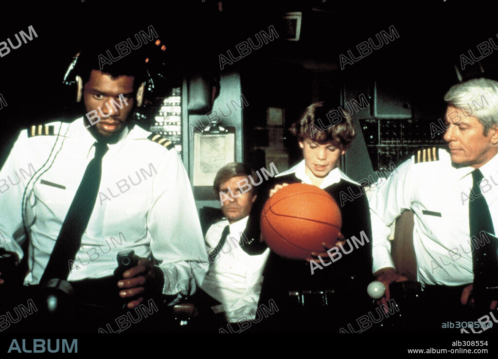 KAREEM ABDUL-JABBAR and PETER GRAVES in AIRPLANE!, 1980, directed by DAVID ZUCKER and JIM ABRAHAMS. Copyright PARAMOUNT PICTURES.