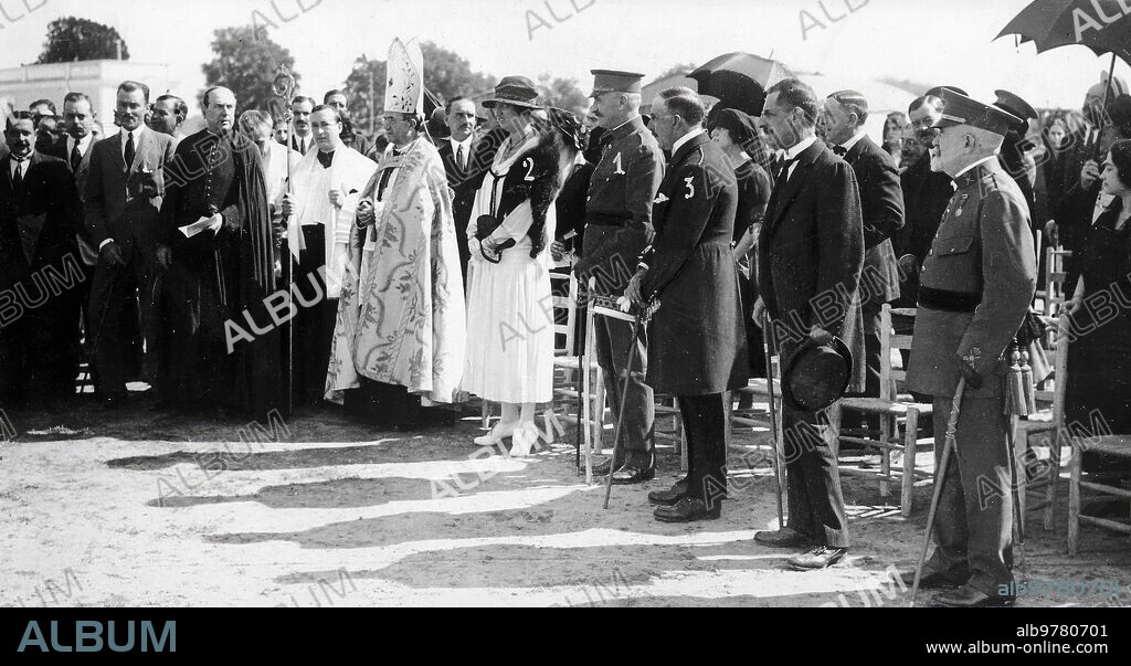 October 1921. Seville. Inauguration of the Air postal service. The prelate giving a beautiful speech before Ss. Ah. the Infants Don Carlos (1) and Doña Luisa (2), the Count of Colombi (3) and the Authorities, before blessing the Plane.
