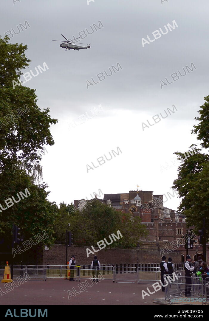 Marine One Helicopter carrying President Trump fly's over on the Mall en route to Buckingham Palace, London, secured by police during the state Visit for President Donald Trump June 2019.