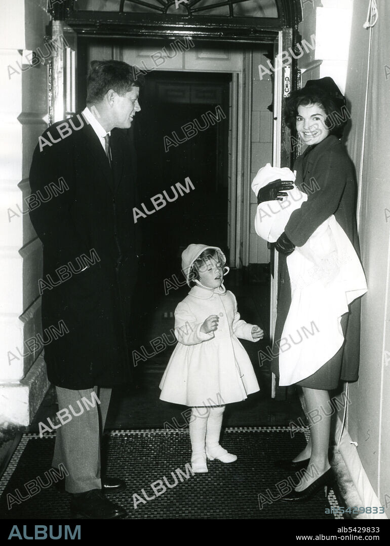 Newly-inaugurated President John F. Kennedy and daughter Caroline bring Mrs. Kennedy and baby John Jr. home to the White House from the hospital. February 4, 1961. Abbie Rowe Photographer.