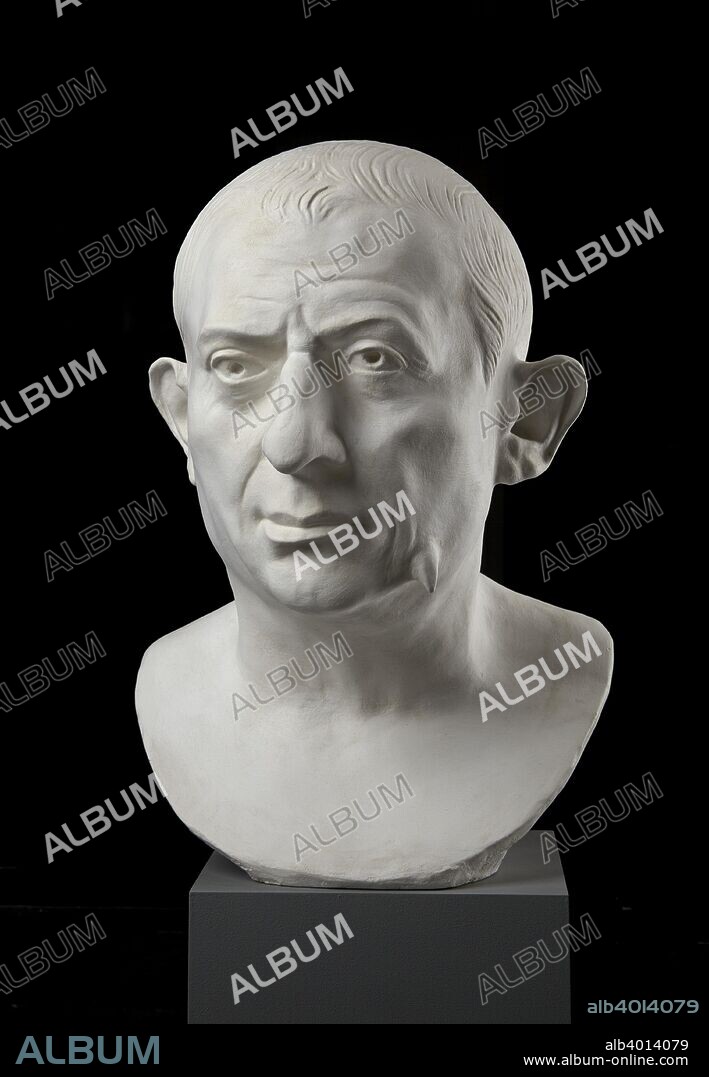 Bust of L Caecilius Iucundus, from Pompeii, AD 60-79. Bust of a middle-aged man, with a wart on the lower left cheek, protruding ears, and finely arranged, engraved hairstyle. The head is identified as a portrait of the banker L Caecilius Iucundus, the last owner of the house in which the head was found. Dimensions: height: 34 cm.
