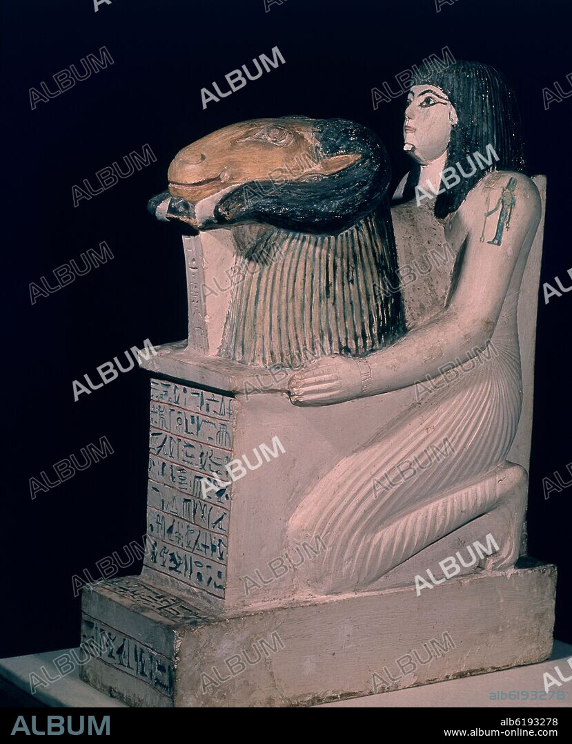 PENMERNEB PRESENTANDO LA CABEZA DE AMON-RA-ESTATUA CALIZA PINTADA-XIX DINASTIA.