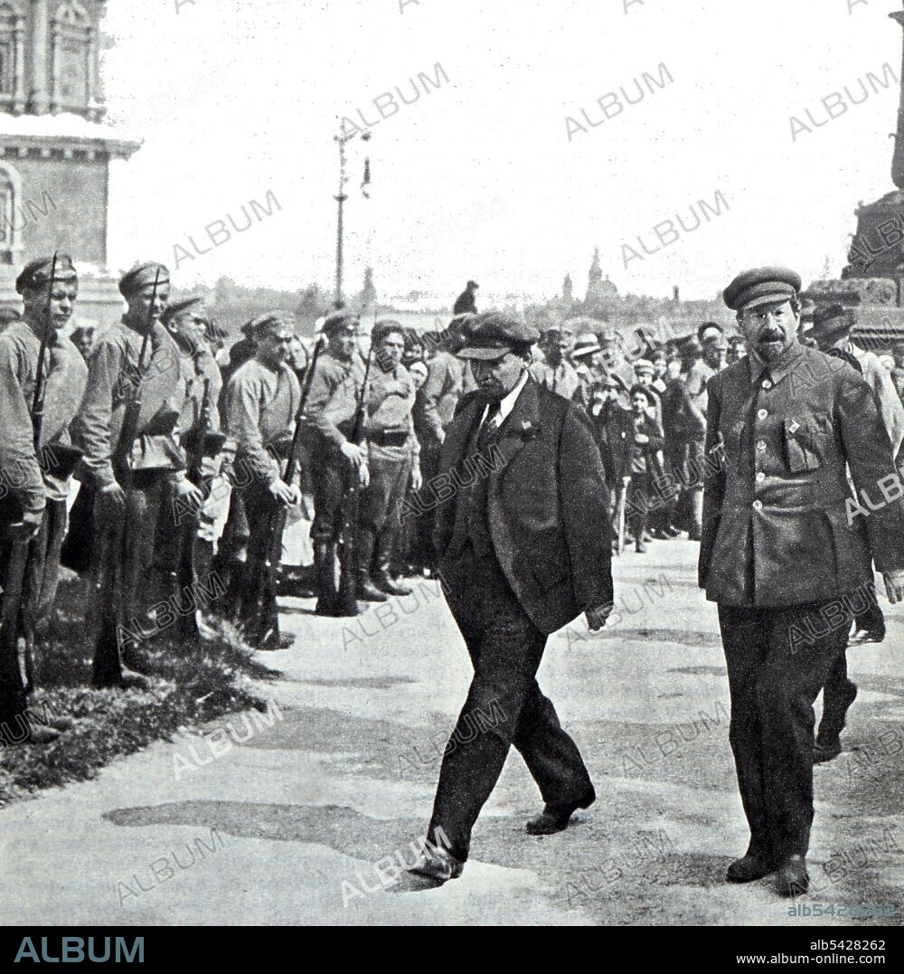 Vladimir Lenin and A. V. Lunacharsky (he was a Russian Marxist revolutionary and the first Bolshevik Soviet People's Commissar (Narkompros) responsible for Ministry and Education as well as an active playwright, critic, essayist and journalist throughout his career. ) walk around the guard of honor, heading to the site of the laying of the monument 'Liberated Labour' on Prechistenskaya Embankment. Moscow, May 1, 1920. Photo by A. Savelyev.