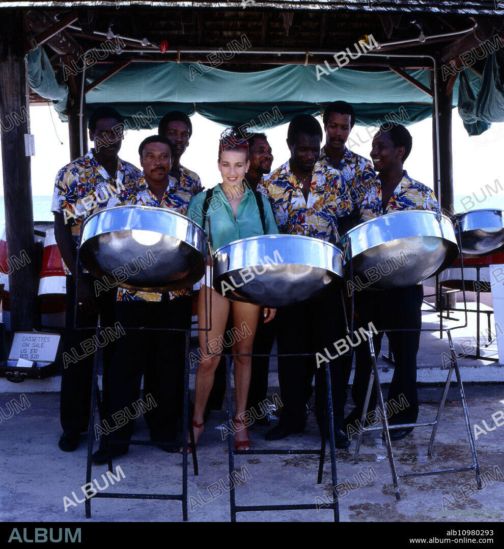 Polish singer, actress and model Danuta Lato on holiday with a local drum band, mid 1980s.