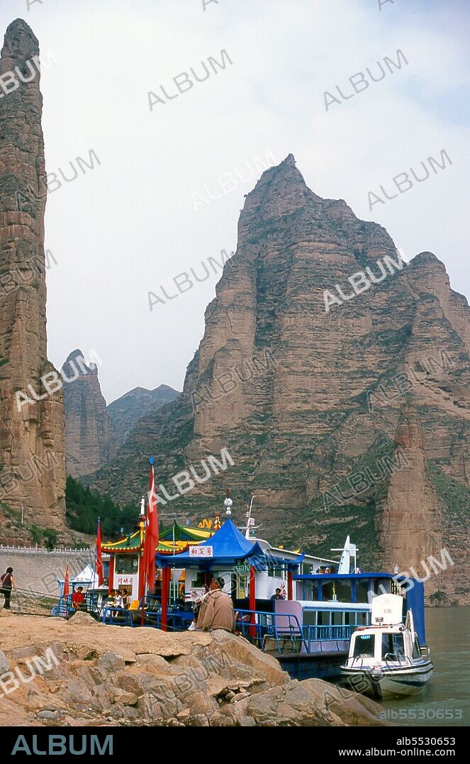 The Yellow River (Huang He), is the most important waterway in China. The region around the confluence of the Huang He and Wei rivers formed the cradle of Chinese civilisation. The river is the third-longest river in Asia, following the Yangtze River and Yenisei River, and the sixth-longest in the world at an estimated length of 5,464 km (3,395 mi). Binglingsi Shiku (Thousand Buddha Caves) is a collection of caves and grottoes set in an inaccessible canyon by the Yellow River about 80km upstream from Lanzhou. The site's very isolation has protected and preserved Binglingsi, not least from marauding Red Guards during the Cultural Revolution (1966 - 76). The first Buddhist grottoes at Binglingsi date from the Eastern Jin Dynasty (c. 317 - 420 CE), and construction continued for well over a thousand years throughout the Tang, Song, Ming and Qing eras. The Bingling caves were often sponsored by wealthy patrons investing some of their Silk Road profits in accruing merit for this life and the next. A total of 183 caves, together with nearly 700 carved stone statues and 82 terracotta sculptures survive, many showing very clear evidence of South Asian Buddhist artistic influences – indeed, art experts agree that Binglingsi is a stylistic midpoint between the former monumental Buddhas of Bamiyan in Afghanistan, and grotto complexes further east within China at Datong and Longmen.