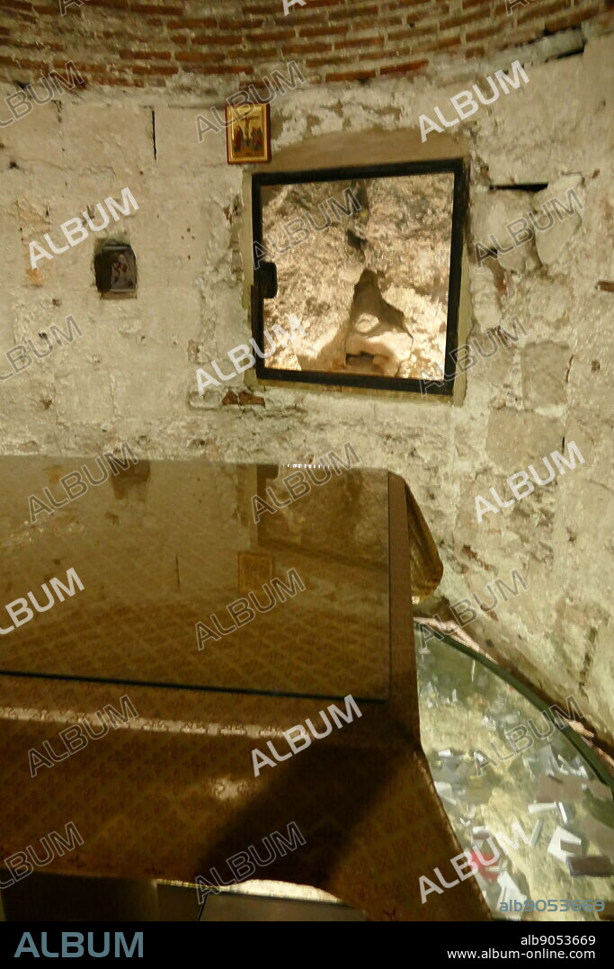 On the south side of the altar, is a stairway climbing to Calvary (Golgotha), traditionally regarded as the site of Jesus' crucifixion. It contains the Rock of Calvary (12th Station of the Cross). The rock can be seen under glass on both sides of the altar, and beneath the altar there is a hole said to be the place where the cross was raised. Church of the Holy Sepulchre, Jerusalem. For Orthodox Christians this church in the Christian Quarter of the Old City of Jerusalem, contains, according to traditions, the two holiest sites in Christianity: the site where Jesus of Nazareth was presented in the temple, where he drove out the money changers and was crucified. Within the church are the headquarters of the Greek Orthodox Patriarch of Jerusalem.