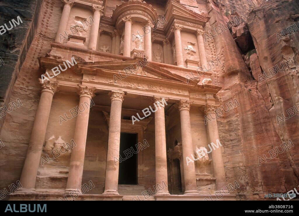 Petra, Jordan. Carved from rock, this treasury (Al Khazneh) was built by the Nabataeans, whose empire lasted from the 4th century BC to the 4th century AD. A long and narrow gorge must be traversed to reach these architectural ruins. This is a World Heritage site.