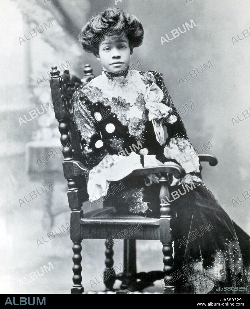 Aida Overton Walker (February 14, 1880 - October 11, 1914) was an African-American vaudeville performer. Her early career was defined by her collaborations with Bert Williams and her husband George Walker, the major black vaudeville and musical comedy powerhouses of the era. She first gained national attention in 1900, with her performance of "Miss Hannah from Savannah" in the show Sons of Ham. For the next ten years, Aida would be known primarily for her work in musical theater. Her song and dance made her an instant hit with audiences at the time. She, George, and Bert continued to produce even more successful shows such as In Dahomey (1902), Abyssinia (1906), and Bandana Land (1908). Her career and performances were praised by critics and she was both financially successful and respected by the industry. Although Aida Walker originally became famous through her partnership with her husband and Bert Williams, her popularity only grew in the years following his death and the end of the Williams and Walker troupe. Shortly after she joined the Smart set company and became a leader of her own vaudeville company. Both were extremely well received. She died in 1914 at the age of 34 from kidney failure. Undated, no photographer credited.