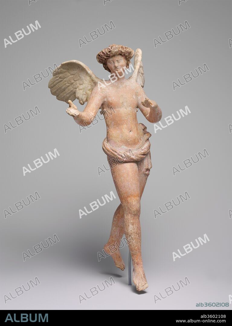 Terracotta statuette of Eros flying. Culture: Greek, Asia Minor, Myrina. Dimensions: H.: 10 1/8 in. (25.7 cm). Date: ca. 200-150 B.C..
Eros wears a thick wreath and a skimpy chlamys (cloak) and is portrayed as a winged adolescent youth, a type that had a long history at Myrina beginning in the late third century B.C. The style of this finely executed terracotta likely reflects influence from the Pergamene school of sculpture, which flourished in the first half of the second century B.C. at the nearby city of Pergamon, seat of the kingdom ruled by the Attalid Dynasty.
