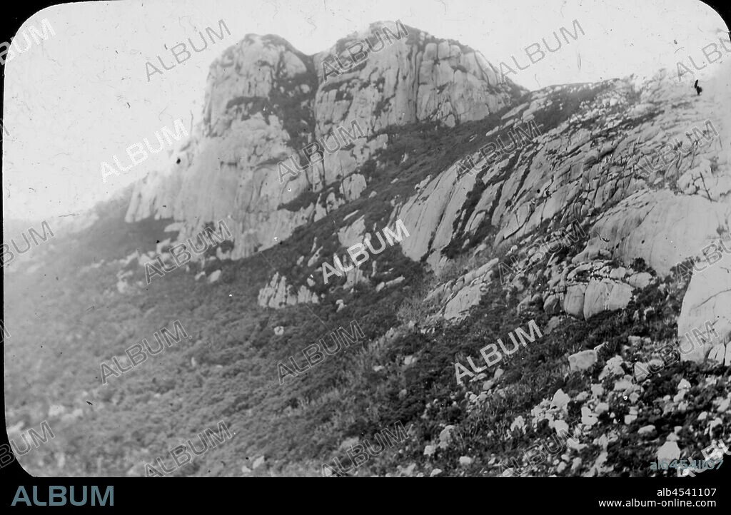 Lantern Slide - Mt Strzelecki, Flinders Island, Tasmania, 1890, Black and white image of the granite face of Mt Strzelecki on Flinders Island, photographed by A.J. Campbell. This is one of many glass lantern slides that form the A.J. Campbell Collection held by Museums Victoria.
