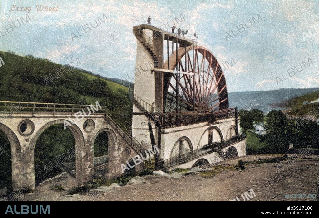 'Laxey Wheel, Isle of Man', 1904. The Laxey Wheel (also known as Lady Isabella) is a large waterwheel built in the town of Laxey in the Isle of Man. Designed by Robert Casement, it is 22 metres in diameter and revolves at about 3 rpm.