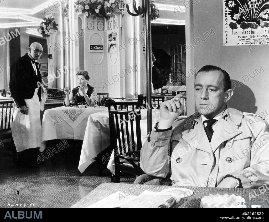 ALEC GUINNESS and NICOLE MAUREY in THE SCAPEGOAT, 1959, directed by ROBERT HAMER. Copyright M.G.M.