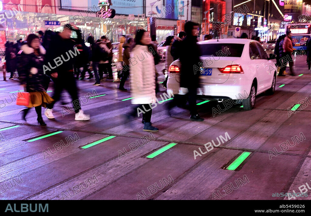 January 17, 2020, Shenyang, Shenyang, China: Liaoning,CHINA-People pass an intelligent zebra crossing at the intersection of Zhonghua road and Taiyuan street in Shenyang, Liaoning province, jan 15, 2020.The glowing crosswalk flashes red, yellow, or green as traffic lights change. (Credit Image: © SIPA Asia via ZUMA Wire).