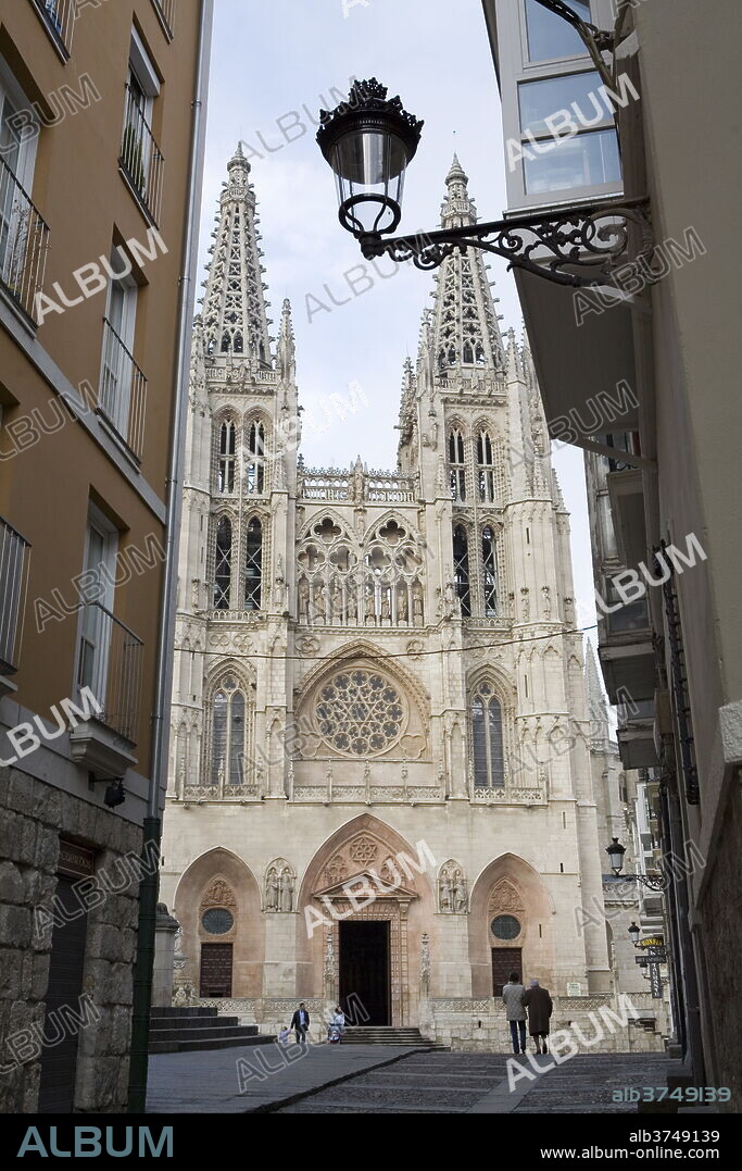 West front of Burgos cathedral, UNESCO World Heritage Site, seen from a narrow side street, Burgos, Castilla y Leon, Spain, Europe.
