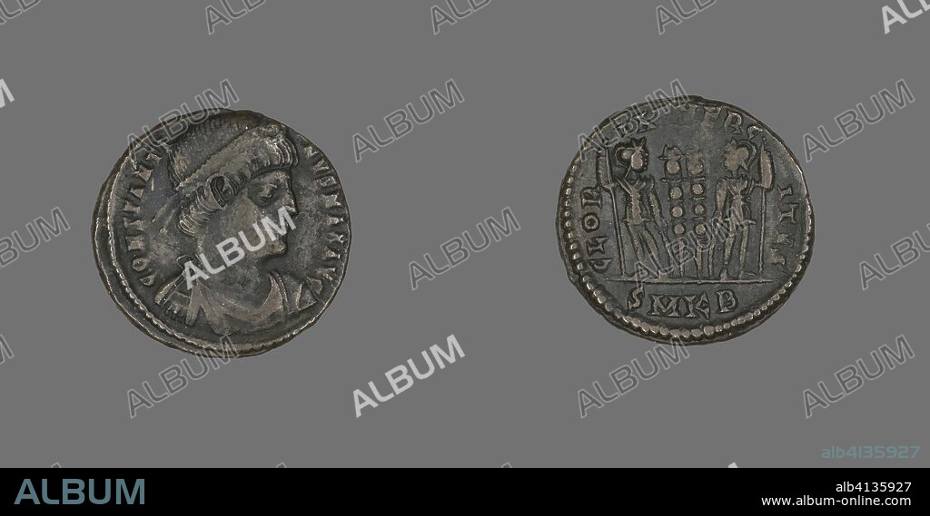 ANCIENT ROMAN. Coin Portraying Emperor Constantine I. Roman, minted in Cyzicus. Date: 331 AD-334 AD. Dimensions: Diam. 1.8 cm; 2.18 g. Bronze. Origin: Roman Empire.