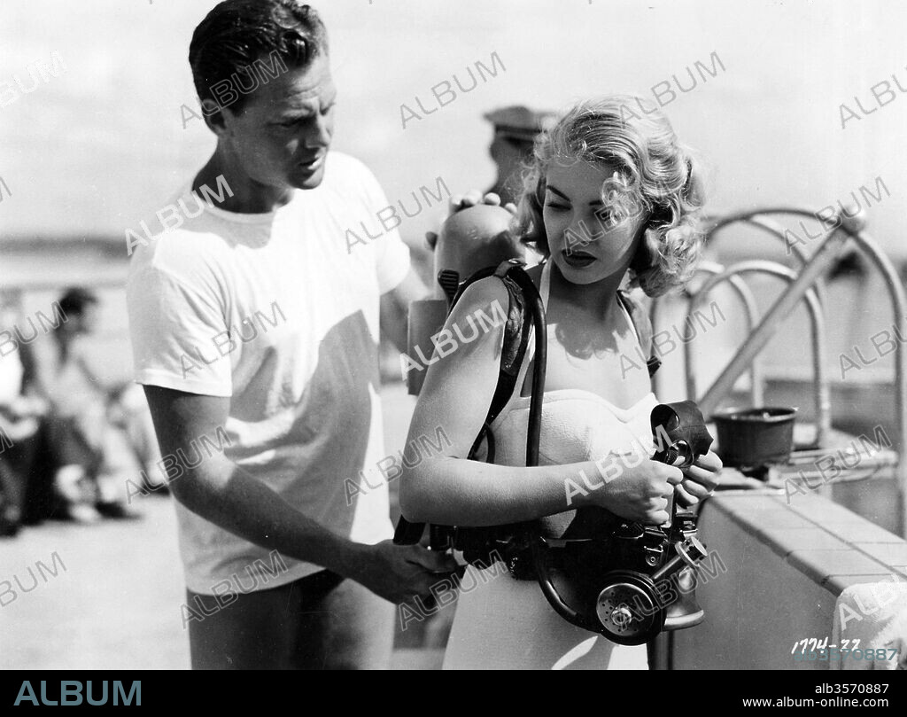 JOHN AGAR and LORI NELSON in REVENGE OF THE CREATURE, 1955, directed by JACK ARNOLD. Copyright UNIVERSAL PICTURES.