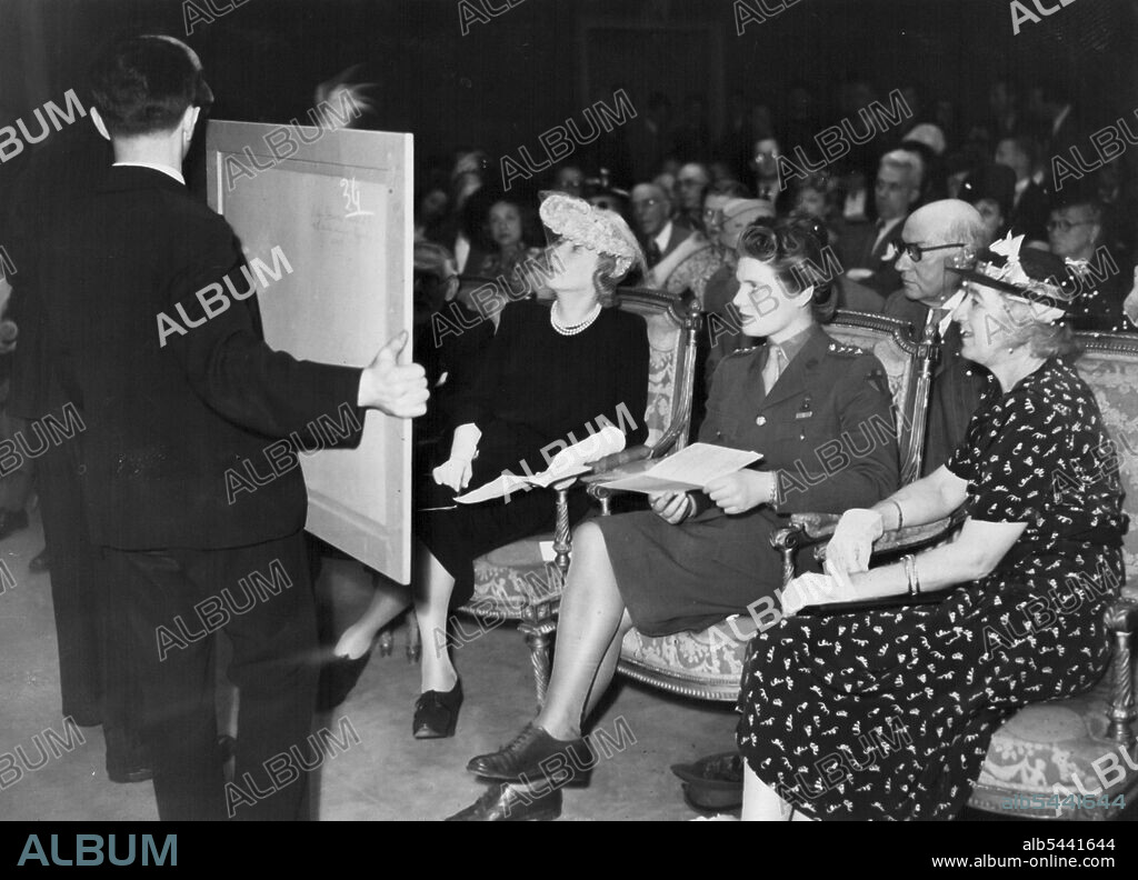 Premiers Daughter Opens Paris Sale -- Miss Churchill with Lady Diana Cooper at the sale. Over £6,000 was raised in Paris for London's child air raid victims at an auction sale of oil paintings and pictures presented by Paris an artists and collectors. Junior Commander Mary Churchill opened the sale. July 23, 1945. (Photo by L.N.A.).